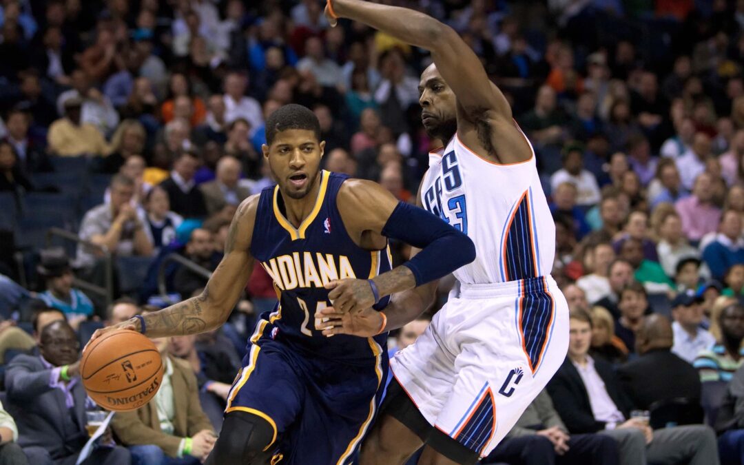Indiana Pacers player shooting over a defender.